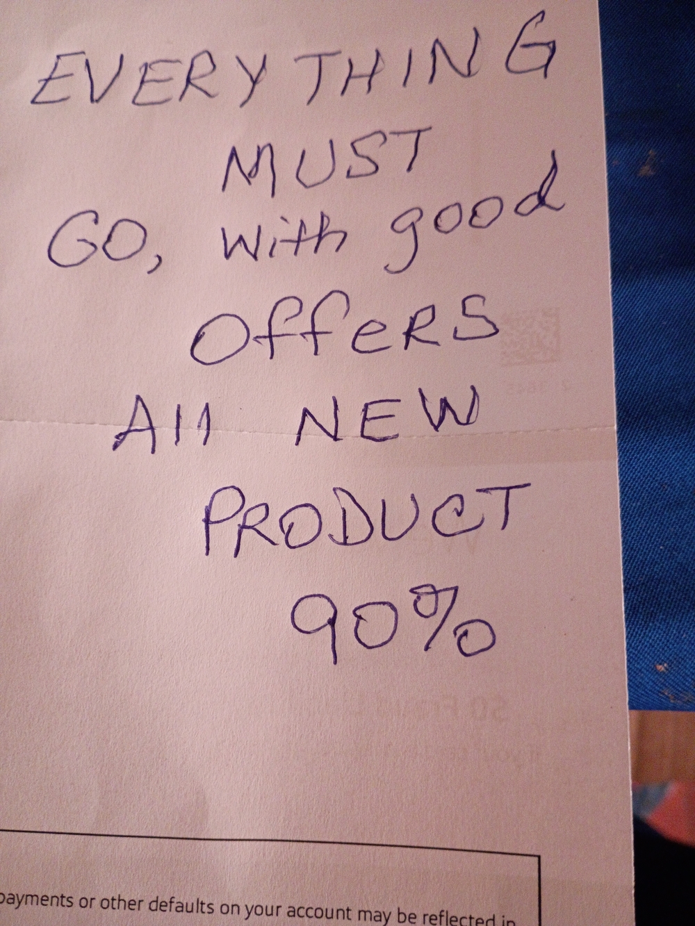 Handwritten Note on White Paper with Blue Ink